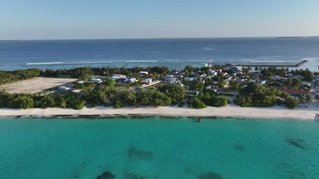 Aerial view of Vashafaru island and turquoise lagoon Maldives. Aerial view of Vashafaru island and turquoise lagoon Maldives.