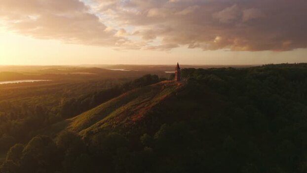Aerial view of Himmelbjerget tower at sunset Denmark.