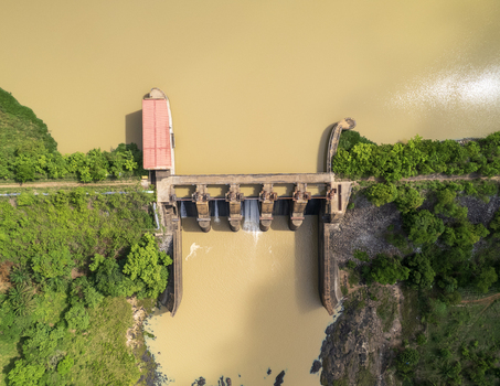 Aerial view of Asejire Dam its concrete structure contrasting with the surrounding lush greenery and muddy waters Asejire Oyo Nigeria. Aerial view of Asejire Dam its concrete structure contrasting with the surrounding lush greenery and muddy waters Asejire Oyo Nigeria.