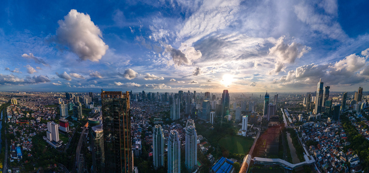 South Jakarta Indonesia 10 January 2026 Aerial view of the modern skyline with skyscrapers under a dramatic sunset sky and scattered clouds. South Jakarta Indonesia 10 January 2026 Aerial view of the modern skyline with skyscrapers under a dramatic sunset sky and scattered clouds.