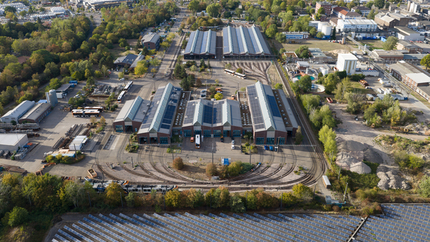 Aerial view of the Rhein Neckar Verkehr GmbH depot with tram tracks industrial buildings and solar panels in Ludwigshafen am Rhein Rheinland Pfalz Germany. Aerial view of the Rhein Neckar Verkehr GmbH depot with tram tracks industrial buildings and solar panels in Ludwigshafen am Rhein Rheinland Pfalz Germany.
