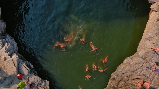 Aerial view of Giola Lagoon with swimmers in Thasos Greece. Aerial view of Giola Lagoon with swimmers in Thasos Greece.