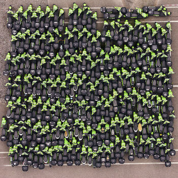 Middenmeer Netherlands 15 June 2026 Aerial view of hundreds of green and black GO Sharing electric scooters parked in a dense grid at a depot in Agriport.
