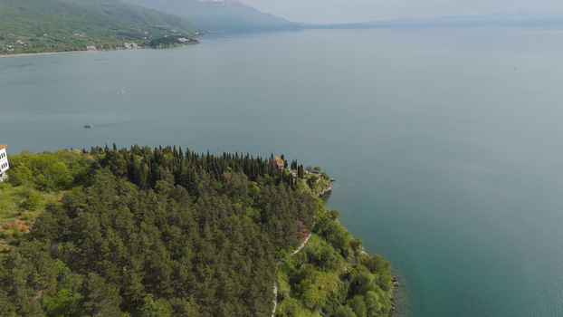Aerial view of the Church of St. John at Kaneo on a cliff overlooking Lake Ohrid surrounded by pine forests in Ohrid Municipality of Ohrid North Macedonia. Aerial view of the Church of St. John at Kaneo on a cliff overlooking Lake Ohrid surrounded by pine forests in Ohrid Municipality of Ohrid North Macedonia.