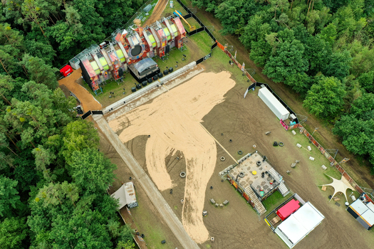 Herzogenaurach Germany 27 July 2025 Aerial view of the Open Beatz Festival stage setup nestled in a forest clearing with sandy ground and dense green trees. Herzogenaurach Germany 27 July 2025 Aerial view of the Open Beatz Festival stage setup nestled in a forest clearing with sandy ground and dense green trees.