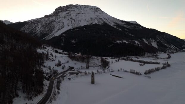Aerial view of submerged bell tower in Graun im Vinschgau Italy. Aerial view of submerged bell tower in Graun im Vinschgau Italy.