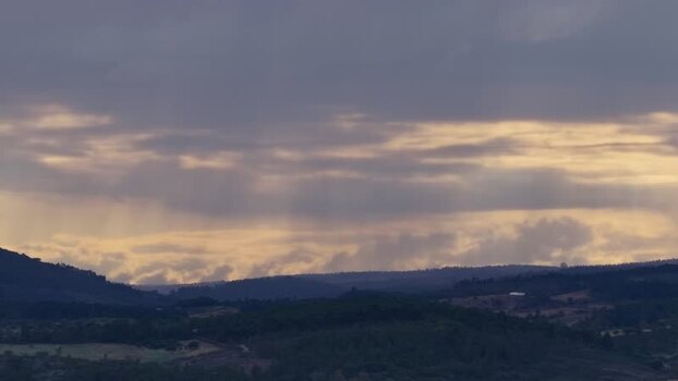 Aerial view of rolling hills and forest at sunset Portugal.
