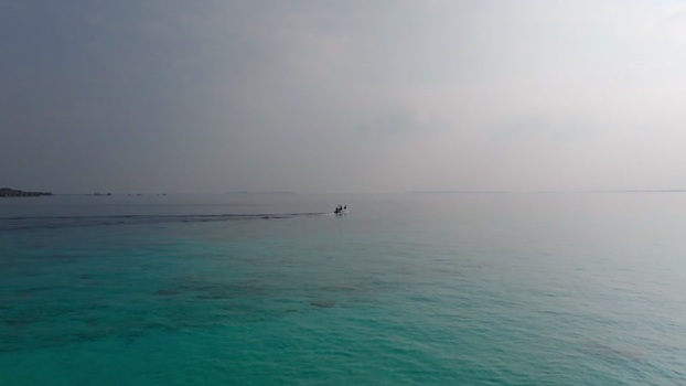 Aerial view of boat sailing on water Maldives.