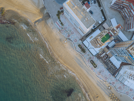 Aerial view of the sandy beach and coastal promenade in Calp Valencian Community Spain. Aerial view of the sandy beach and coastal promenade in Calp Valencian Community Spain.