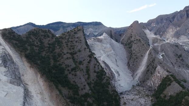Aerial view of Carrara marble quarries in the mountains Italy. Aerial view of Carrara marble quarries in the mountains Italy.