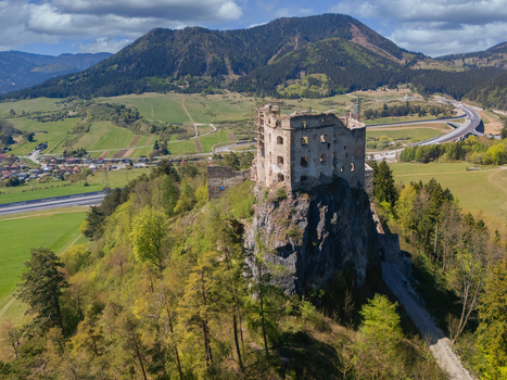 Aerial view of Castle Likava ruins on a rocky cliff surrounded by forests and mountains in Likavka Zilina Region Slovakia. Aerial view of Castle Likava ruins on a rocky cliff surrounded by forests and mountains in Likavka Zilina Region Slovakia.
