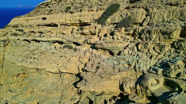 Aerial view of the ancient caves in the cliffs of Crete Greece.