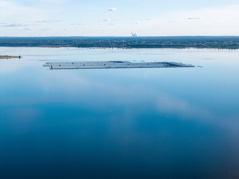 Aerial view of the floating solar park on Cottbuser Ostsee a former open pit mine showing the solar panels on the calm lake surface in Cottbus Brandenburg Germany. Aerial view of the floating solar park on Cottbuser Ostsee a former open pit mine showing the solar panels on the calm lake surface in Cottbus Brandenburg Germany.