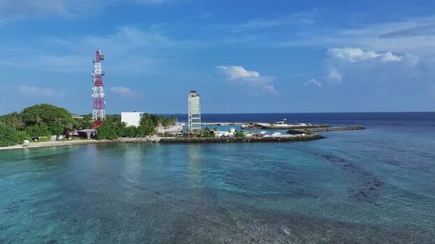 Aerial view of Kamadhoo island with a telecom tower Maldives. Aerial view of Kamadhoo island with a telecom tower Maldives.