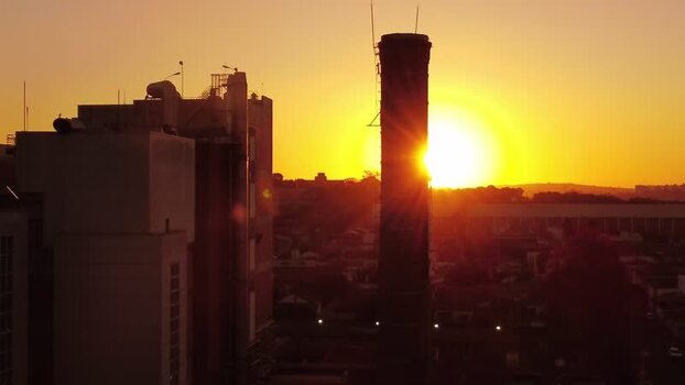 Aerial view of industrial chimney at sunset in Araras Brazil. Aerial view of industrial chimney at sunset in Araras Brazil.