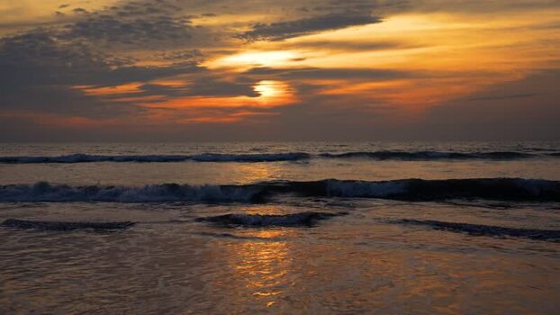 View of the sunset over the waves at Cox s Bazar Bangladesh. View of the sunset over the waves at Cox s Bazar Bangladesh.