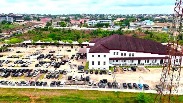 Aerial view of a large building and busy parking lot Nigeria. Aerial view of a large building and busy parking lot Nigeria.