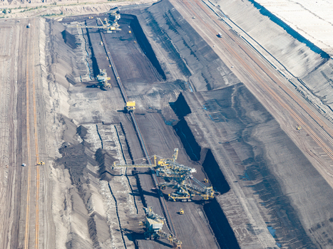 Aerial view of Tagebau Welzow Sud brown coal open pit mine with massive bucket wheel excavators and conveyor systems operating in Spremberg Brandenburg Germany. Aerial view of Tagebau Welzow Sud brown coal open pit mine with massive bucket wheel excavators and conveyor systems operating in Spremberg Brandenburg Germany.