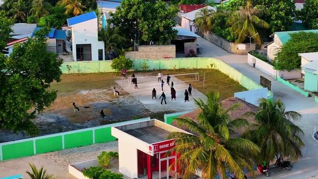 Aerial view of people playing volleyball Maldives.