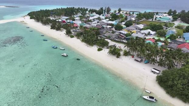 Aerial view of a tropical island village Maldives. Aerial view of a tropical island village Maldives.
