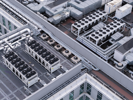 Aerial view of industrial HVAC cooling systems and ventilation infrastructure on the rooftop of a modern data center in Krakow Lesser Poland Voivode Poland.
