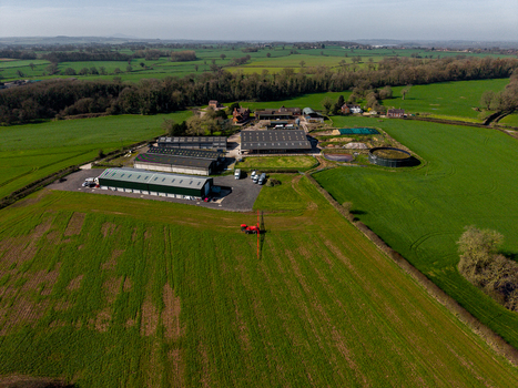 Aerial view of Gnosall Heath farm complex with agricultural buildings storage sheds and surrounding green fields in Gnosall England United Kingdom. Aerial view of Gnosall Heath farm complex with agricultural buildings storage sheds and surrounding green fields in Gnosall England United Kingdom.