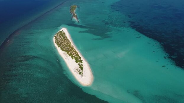 Aerial view of a tropical sandbank and turquoise lagoon Maldives.