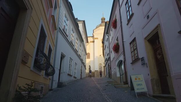 View of a historic street leading to a church in Olomouc Czechia. View of a historic street leading to a church in Olomouc Czechia.