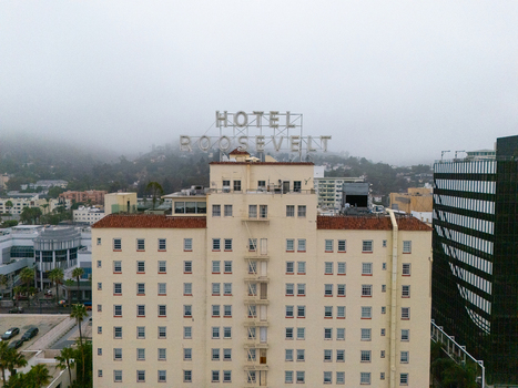 Los Angeles California United States 25 September 2026 Aerial view of the historic Hollywood Roosevelt Hotel on the Hollywood Walk of Fame with its rooftop sign and misty hills.
