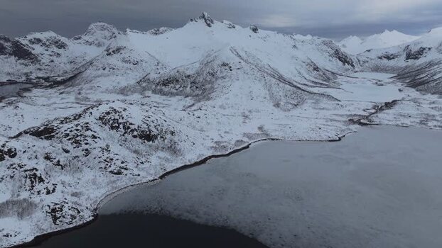 Aerial view of Lofoten mountains and lake in Norway.