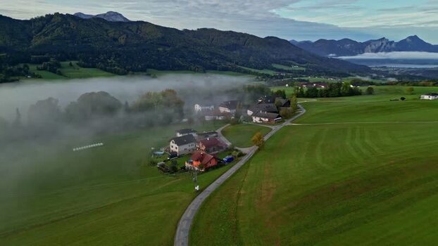 Aerial view of Attersee region with houses and green fields Austria.