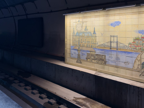 View of a decorative tiled mural depicting Istanbul landmarks on a subway station platform wall above the tracks in Beylikduzu Istanbul Turkiye. View of a decorative tiled mural depicting Istanbul landmarks on a subway station platform wall above the tracks in Beylikduzu Istanbul Turkiye.