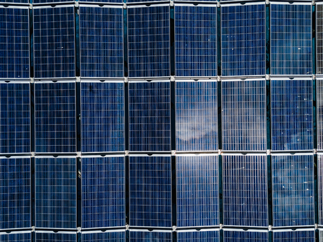 Aerial view of the SolarSea floating solar power plant by Swimsol with a grid of blue photovoltaic panels reflecting the sky in Dharavandhoo Baa Atoll Maldives. Aerial view of the SolarSea floating solar power plant by Swimsol with a grid of blue photovoltaic panels reflecting the sky in Dharavandhoo Baa Atoll Maldives.