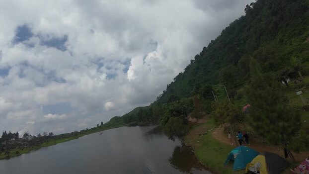 Aerial view of Rawa Gede Jonggol Lake and green hills Indonesia.