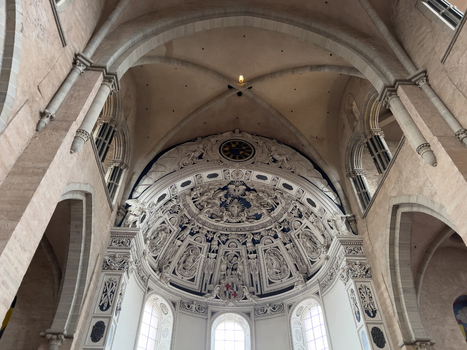 View of the ornate vaulted ceiling and intricate baroque altar inside the historic Trier Cathedral with stone arches and detailed religious carvings in Trier Rheinland Pfalz Germany.