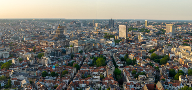 Aerial view of the Brussels cityscape featuring the Palais de Justice dense urban architecture historic rooftops and distant skyscrapers in Brussels Brussels Belgium. Aerial view of the Brussels cityscape featuring the Palais de Justice dense urban architecture historic rooftops and distant skyscrapers in Brussels Brussels Belgium.