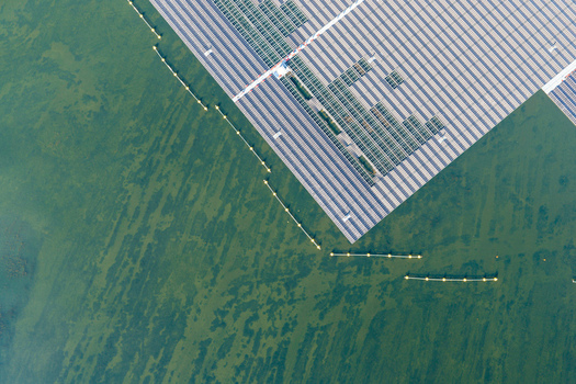 Aerial view of the floating solar park at Cottbuser Ostsee showing repair works on the solar panels after storm damage at the former open pit mine in Cottbus Brandenburg Germany. Aerial view of the floating solar park at Cottbuser Ostsee showing repair works on the solar panels after storm damage at the former open pit mine in Cottbus Brandenburg Germany.