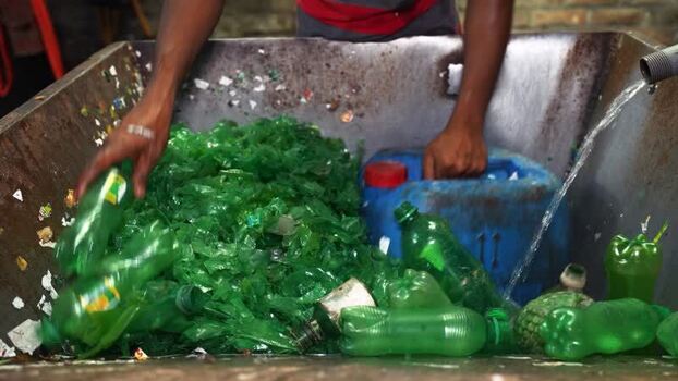 View of workers sorting plastic bottles for recycling Bangladesh. View of workers sorting plastic bottles for recycling Bangladesh.