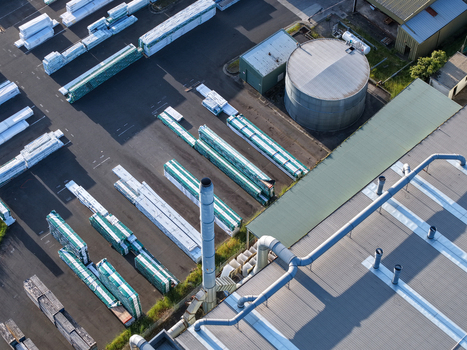 Melbourne Australia 22 September 2026 Aerial view of industrial factories in Kilsyth with large storage tanks rows of packaged materials and metal roofing. Melbourne Australia 22 September 2026 Aerial view of industrial factories in Kilsyth with large storage tanks rows of packaged materials and metal roofing.