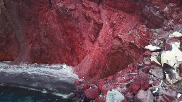 Aerial view of Red beach volcanic cliffs Greece.