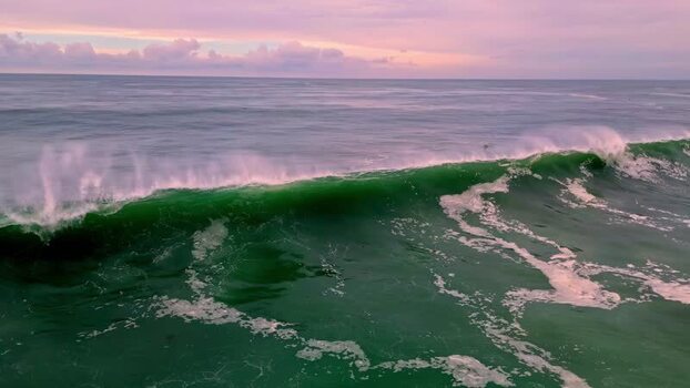 Aerial view of ocean waves at sunset United States.