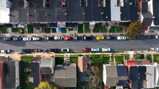 Aerial view of a residential street in northeast Lancaster with rows of houses and parked cars in morning light Lancaster Pennsylvania United States.