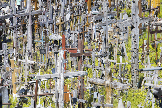 View of Hill of Crosses with thousands of wooden and metal crucifixes standing amidst green grass Siauliu Siauliu apskritis Lithuania. View of Hill of Crosses with thousands of wooden and metal crucifixes standing amidst green grass Siauliu Siauliu apskritis Lithuania.
