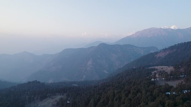 Aerial view of misty mountain ridges in Chopta India.