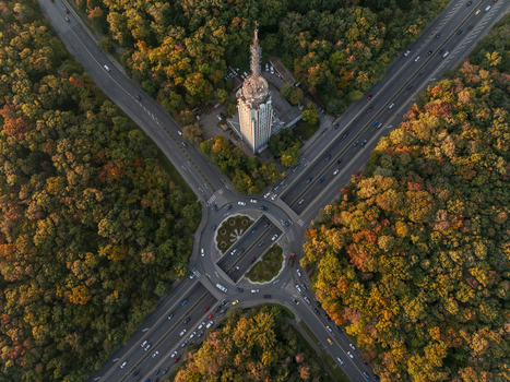 Aerial view of the Sofia Television Tower surrounded by a vibrant autumn forest and a busy road intersection in Sofia Sofia City Province Bulgaria. Aerial view of the Sofia Television Tower surrounded by a vibrant autumn forest and a busy road intersection in Sofia Sofia City Province Bulgaria.