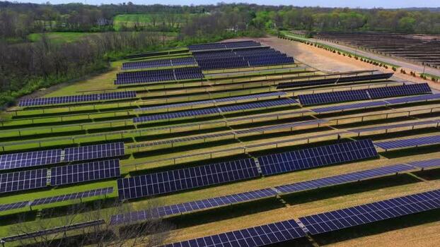Aerial view of a large solar farm with rows of panels United States. Aerial view of a large solar farm with rows of panels United States.