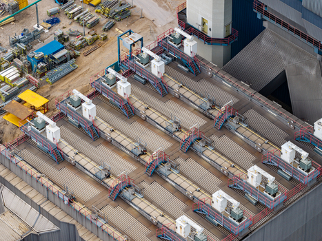 Aerial view of the Heizkraftwerk Reuter West power plant featuring industrial machinery and equipment on the roof during a transition to renewable energy in Berlin Berlin Germany.