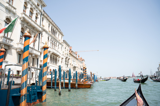 Venice Italy 29 March 2026 View of the Grand Canal s vibrant blue waters reflecting the creamy facades of historic buildings while gondolas glide beneath a clear sky. Venice Italy 29 March 2026 View of the Grand Canal s vibrant blue waters reflecting the creamy facades of historic buildings while gondolas glide beneath a clear sky.