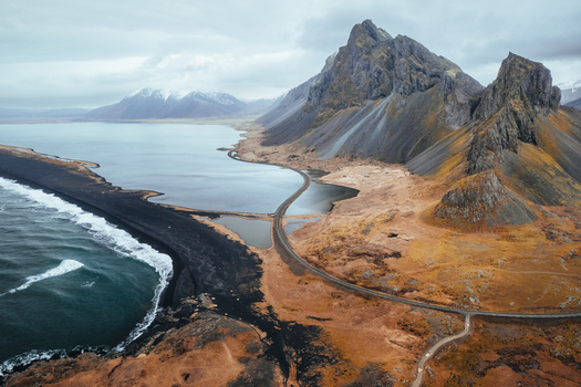 Aerial view of Hvalnes Nature Reserve Beach with its black sand coastline and the jagged peaks of Eystrahorn mountain Sveitarfelagid Hornafjordur Iceland. Aerial view of Hvalnes Nature Reserve Beach with its black sand coastline and the jagged peaks of Eystrahorn mountain Sveitarfelagid Hornafjordur Iceland.