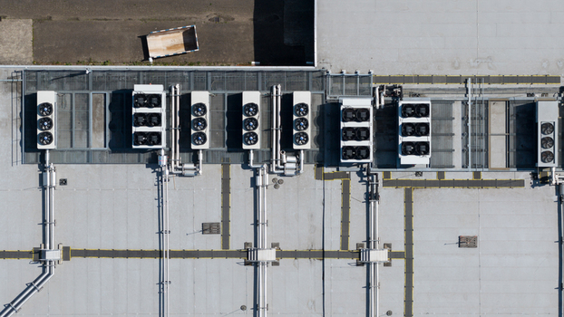 Aerial view of industrial HVAC units ventilation fans and complex piping systems on a flat rooftop Utrecht Utrecht Netherlands. Aerial view of industrial HVAC units ventilation fans and complex piping systems on a flat rooftop Utrecht Utrecht Netherlands.